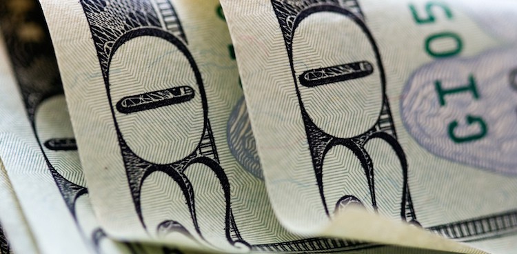 three crisp twenty dollar bills