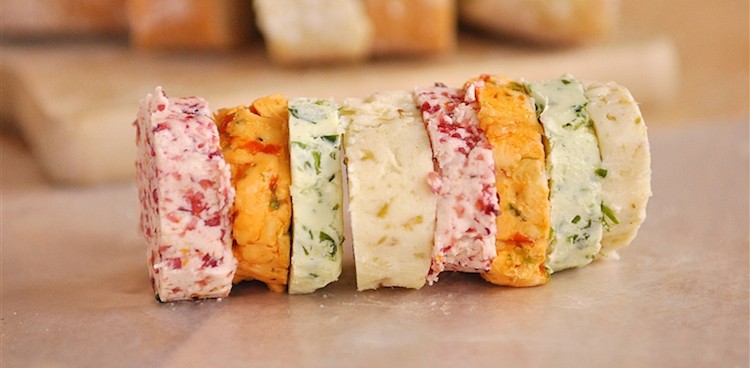 brightly colored slices of flavored butter in a row like lifesavers