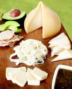 A spread of Mexican cheeses including queso fresco, queso oakaca, and tetilla DOP