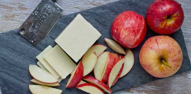 Vermont apples and cabot cheddar on a slate