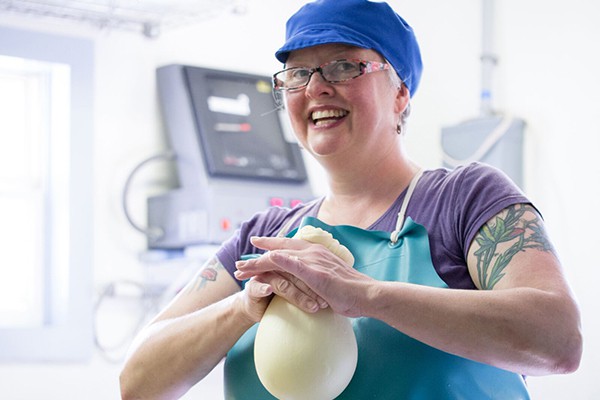 Rachel Fritz shaping cheese