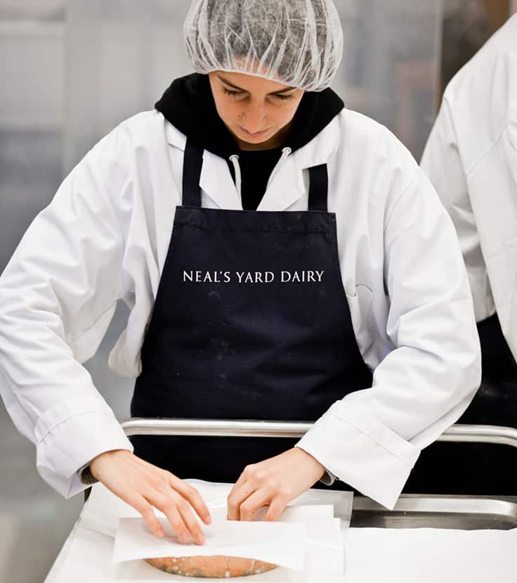 Wrapping Cardo, a goat's milk cheese from Sleight Farm, in wax paper at the Druid Street railway arches (Photo by Piotr Malecki)
