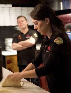 Giorgia Caporuscio works with dough