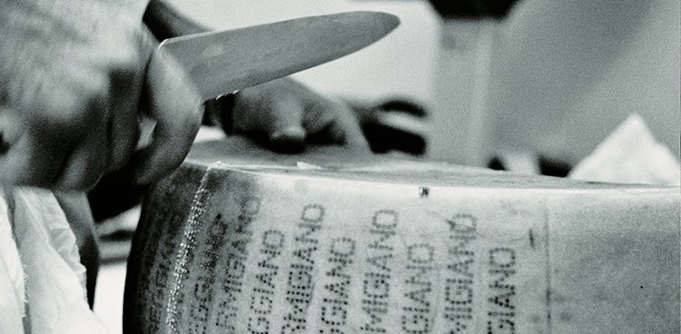Cracking into a wheel of Parmigiano-Reggiano