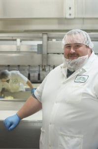Production supervisor Greg Joslyn makes cheddar