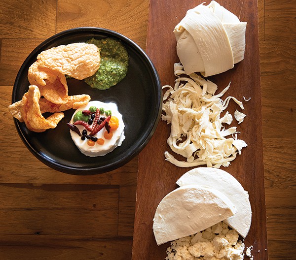 Queso del Rancho, a signature dish at Xochi, is topped with grasshoppers, maguey worms, and flying ants