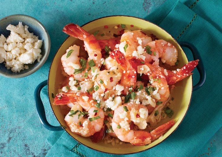baked garlic shrimp topped with herbs and cotija